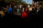 Vets attend a morning roll call early at Grand Veterans Village, a transitional housing campus run by U.S.Vets in Phoenix.