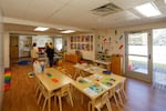 People stand in RoseMary's Place, a child care agency on the Columbia County Health System campus in Dayton, Washington.