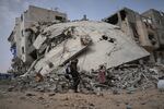 A man passes by the destroyed house of journalist Islam Meqdad, where she was killed along with her son and five other family members in an Israeli army strike in Khan Younis, southern Gaza Strip, Sunday, April 6, 2025.