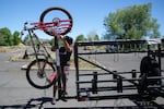 Mo Elwefati secures his bike on the Transit to Trails Shuttle in Bend, Ore., on June 17, 2026.