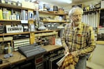 Dennis Darby still works on sound engineering equipment in his home workshop. Northeast Portland, Dec. 27, 2024