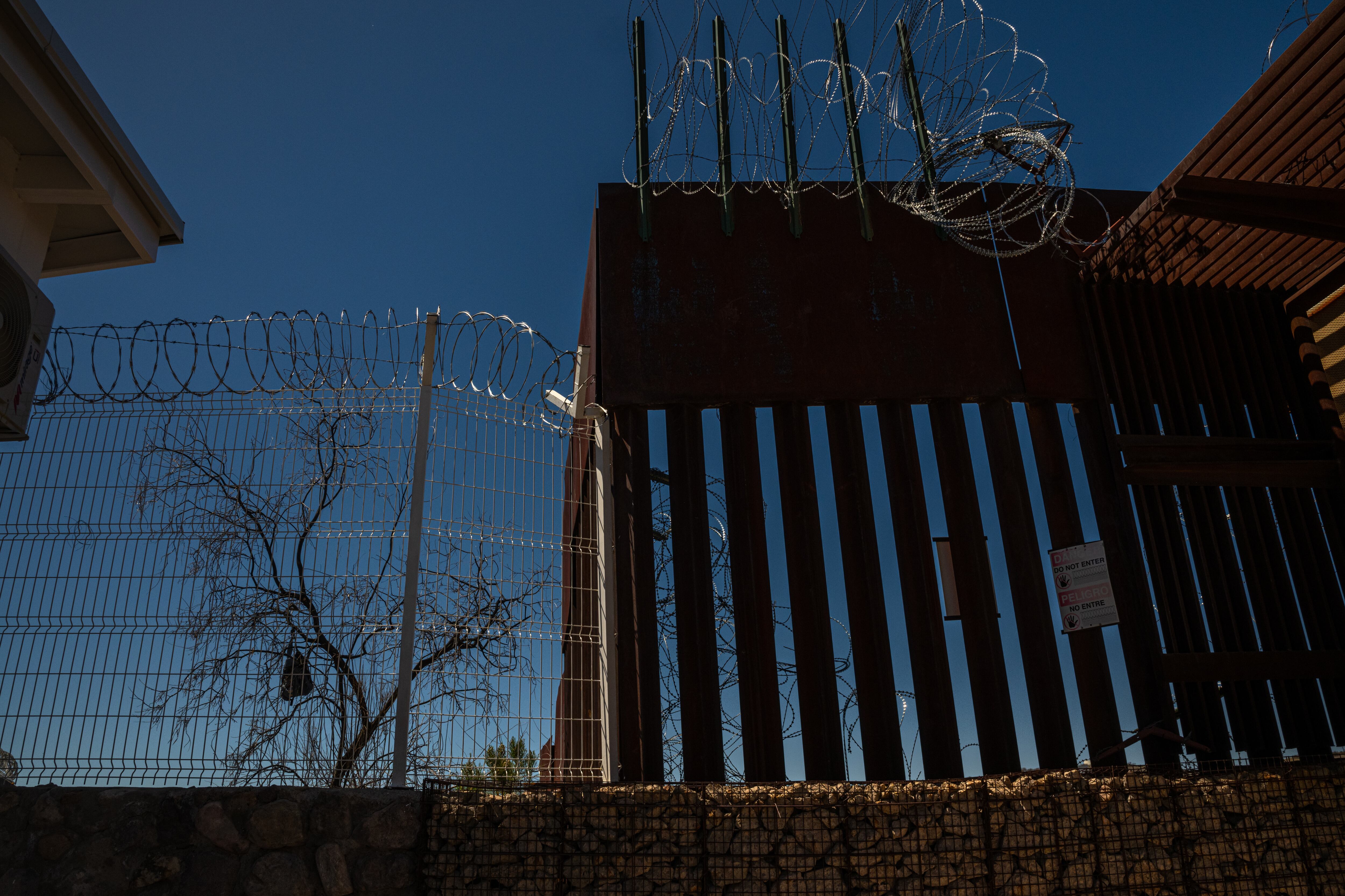 Razor wire sits atop the U.S.-Mexico border fence in Nogales, Ariz., as seen here on March 27.