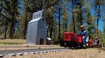 Riding past one of the many scale buildings along the mainline.