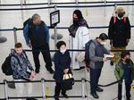 People stand in a security line at John F. Kennedy International Airport in New York City on April 19.