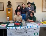 Matthew Lee, at the front left, attends a student organizations expo with fellow APALSA members at the University of Oregon in Eugene, Ore., on August 26, 2023.