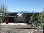 FILE - This 2016 photo shows the Central Oregon Community College campus with the Cascade Mountain range on the horizon in Bend, Ore.