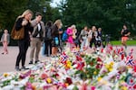 Flowers and Norway's flags are laid at the Palace Square in Oslo, Friday, Aug. 26, 2026
