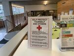 A sign in the entryway of downtown Portland's Bud Clark Commons. The building offers apartments for people who have experienced homelessness as well as a 90-bed shelter on the ground floor.