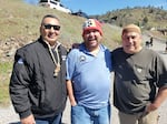 Phillip Williams, Arron "Troy" Hockaday, and Leaf Hillman share stories from times past as they celebrate the release of year-old coho salmon into the Klamath River.