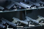Glock and Walther Arms semi-automatic pistols are displayed for sale in a gun store in Arizona on Sept. 17, 2025.