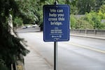 Suicide hotline sign on the Vista Bridge in Portland.