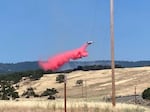 An aircraft drops retardant on a fire in ODF's Southwest Oregon District in 2020.