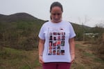 Monica dos Santos, 39, wears a T-shirt with the photos of victims of a dam break in Bento Rodrigues, Minas Gerais state, Brazil, Oct. 19, 2024. Victims of Brazil’s worst environmental disaster, on Nov. 5, 2015, took their case for compensation to a UK court on Monday, Oct. 21, 2024, almost nine years after tons of toxic mining waste poured into a major waterway, killing 19 people and devastating local communities.