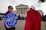The Supreme Court is seen on the first day of the new term as activists demonstrate on the plaza, in Washington, Monday, Oct. 4, 2021. Arguments are planned for December challenging Roe v. Wade and Planned Parenthood v. Casey, the Supreme Court's major decisions over the last half-century that guarantee a woman's right to an abortion nationwide.