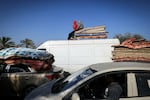 Palestinian families flee Khan Younis, in southern Gaza, on Jan. 22.