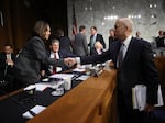 Former Homeland Security Secretary Jeh Johnson greets Sen. Kamala Harris, D-Calif.,  at a hearing of the Senate Intelligence Committee on March 21, 2018.