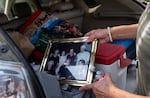 Lisa Sethmann show some of the personal items she gathered when she evacuated from her home in Friend, Ore. 