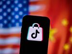 A photo illustration of the TikTok logo next to U.S. and China flags. Researchers have uncovered more accounts tied to a Chinese influence operation known as "Spamoflauge" which includes an account on TikTok with one video that managed to get 1.5 million views before being taken down.