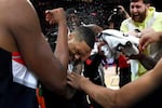 Portland Trail Blazers guard Damian Lillard, center, is doused by teammates after setting franchise and career highs with 71 points during an NBA basketball game against the Houston Rockets in Portland, Ore., Sunday, Feb. 26, 2023.