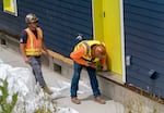 Workers install a “Mass Casita” in Otis, Ore., in this June 7, 2023 file photo. The Oregon legislature approved $5 million in 2021 for a pilot project to study the use of mass timber for modular home construction, determining if this could be utilized to address Oregon’s housing shortage. This home is one of six in the project, all installed in different climates and regions throughout Oregon.