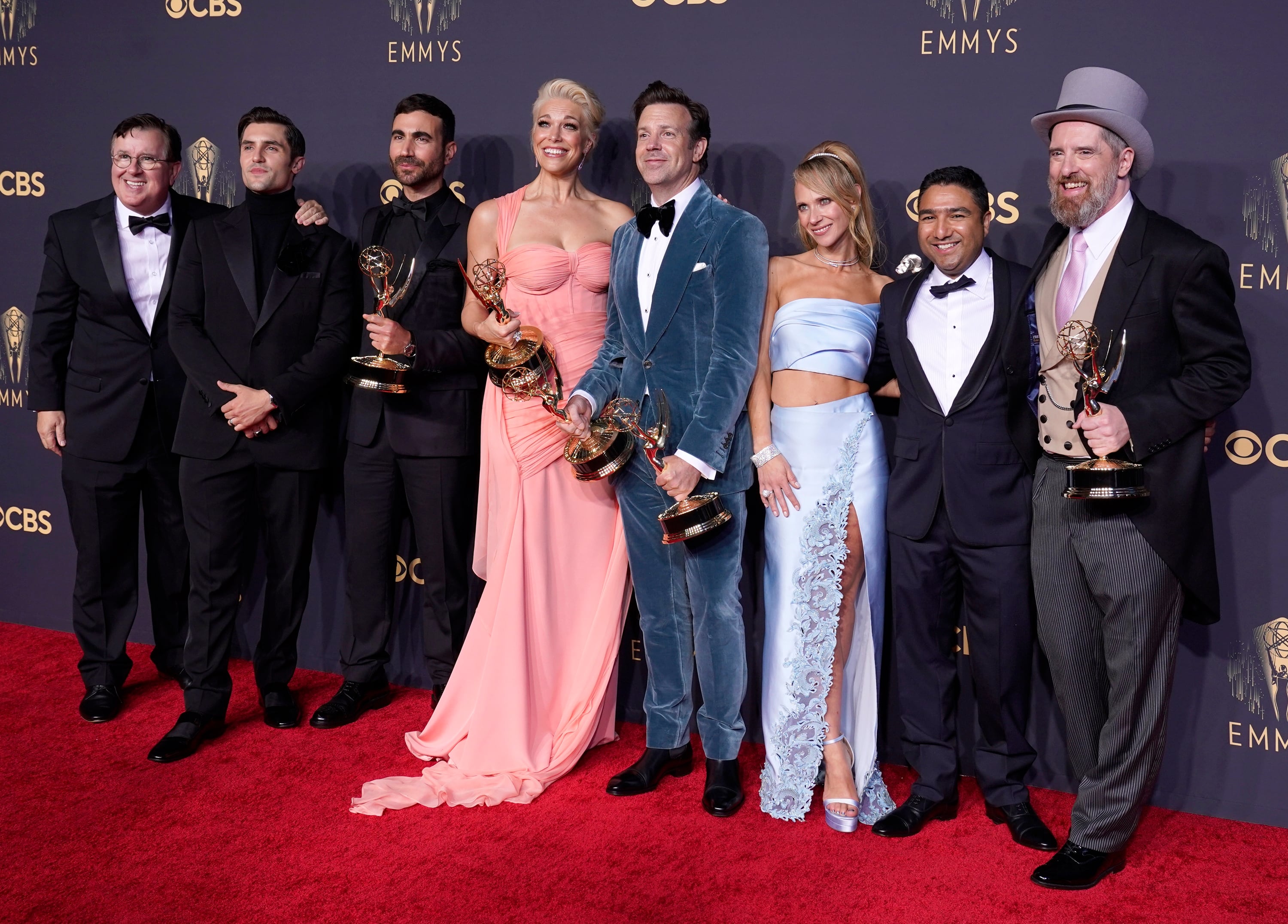 Brett Goldstein (from left), Hannah Waddingham, Jason Sudeikis, Juno Temple and the cast and crew from <em>Ted Lasso</em> — about an American college football coach who is hired to manage a London soccer team — pose with their awards at the 73rd Primetime Emmy Awards on Sept. 19, 2021, in Los Angeles.