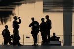 Members of the Army National Guard congregate near the Lincoln Memorial Reflecting Pool on July 02, 2026 in Washington, DC.