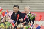FILE: Bloomberg Best Of U.S. President Donald Trump 2017 - 2020: U.S. President Donald Trump, right, and Xi Jinping, China's president, greet attendees waving American and Chinese national flags during a welcome ceremony outside the Great Hall of the People in Beijing, China, on Thursday, Nov. 9, 2017. Our editors select the best archive images looking back at Trumps 4 year term from 2017 - 2020. Photographer: Qilai Shen/Bloomberg via Getty Images