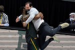 Baylor head coach Scott Drew gets a hug from guard Mark Vital at the end of the championship game against Gonzaga in the men's Final Four NCAA college basketball tournament, Monday, April 5, 2021, at Lucas Oil Stadium in Indianapolis. Baylor won 86-70.