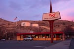 The sun sets over Jerry's restaurant, in Lakeview, Ore, on Dec. 9 , 2025. The diner closed in 2024 after over 50 years in business, and is one of several buildings up for sale in the town.