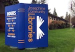 In this April 7, 2017, photo, a large display stands in the lawn of the main Josephine County library branch in Grants Pass, Ore.