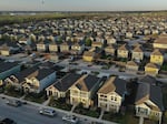 Some baby boomers find that when they want to downsize, there are no smaller options in their neighborhoods. Single-family homes are seen in a neighborhood in San Marcos, Texas, last month.