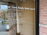 The front glass doors with names of doctors who practice at West Linn Family Health Center.