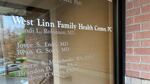 The front glass doors with names of doctors who practice at West Linn Family Health Center.