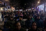 Residents of the Jackson Heights neighborhood anxiously look on for the evening's election results during an election night watch party in Diversity Plaza.