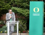 University of Oregon President Karl Scholz speaks to alumni, donors and current student and faculty at the UO Portland campus outdoor amphitheater on May 29, 2025.