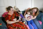 Mia Storm holds her daughter Lily, 3, as they spend time with Mia's mother Penny Woods. Woods gave Mia up to the state in 1988 while experiencing mental health problems. Storm, now 32, and her mother reconnected recently and have been working to rebuild their relationship.