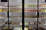 Desserts in a case at El Torito next to the panadería, including options such as fresas con crema, flan and sheet cakes.