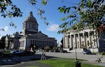 FILE - The afternoon sun illuminates the Legislative Building, left, at the Capitol in Olympia, Wash., Oct. 9, 2018.