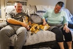 In the middle of the couch from left, Steve "Snaggletooth" Buscemi, Blue and Shorty get scritches from their owners Wendy and Larry Nevers. The Nevers faced a significant homeowners' insurance rate increase at the end of their first year living in Idaho.