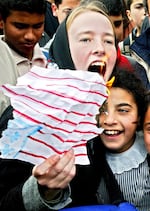 American activist Rachel Corrie, 23, shouts during an anti-war, pro-Iraq rally by Palestinians and foreign activists in February 2003 in the Rafah refugee camp in the Gaza Strip.