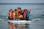 A dinghy arrives on the northern shore of the Greek island of Lesbos. This arrival is composed predominantly of Syrians. Each arrival carries 40-50 people, who pay smugglers $1,200-$1,500 Euros each to supply them with a dinghy. The smugglers do not bring the refugees from Turkey to Greece; they simply point them towards Greece, turn on the outboard engine, and shove them into the sea. 