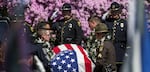 Law enforcement, fire and rescue and members of the community gather at the University of Portland's Chiles Center for Cowlitz County Sheriff's Deputy Justin DeRosier's memorial service on April 24, 2019, in Portland, Oregon.