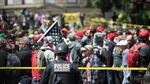 A police officer watches the crowd at a pro-Trump free speech rally in Portland, Oregon, Sunday, June 4, 2017. 