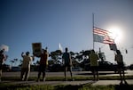 Demonstrators lining the corner of Daniels Parkway and U.S. 41 hold signs at the No Kings demonstration in Fort Myers on Saturday, October 18, 2025.
