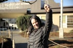 Claudia Brown celebrates a tentative end to the strike as she arrives to start teaching again at Lent Elementary in Southeast Portland on Monday.