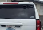 A black-and-white flag with a blue bar at its center is affixed to a Clark County Sheriff's Office SUV. Global protests against police brutality have renewed criticism of the symbol.