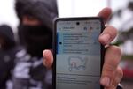 A migrant seeking asylum holds up the CBP One app showing his appointment was canceled after President Donald Trump was sworn into office, Jan. 20, 2025, in Matamoros, Mexico. A federal judge Wednesday struck down Trump's suspension of asylums at the southern border.