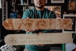 Victor "Marka27" Quiñonez holds portions of his sculpture from the I.C.E. SCREAM series in his studio.