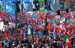 Demonstrators take part in a march organized by Italy's main labor unions in Rome's St. John Lateran square.