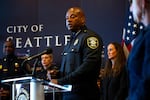 Interim Police Chief Andre Sayles addresses reporters at his first press conference since being asked to lead the Seattle Police Department on July 31, 2026. Seattle Mayor Katie Wilson stood behind him.